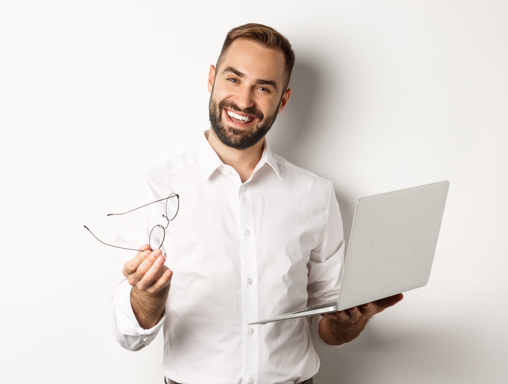 Finance manager smiling holding a laptop